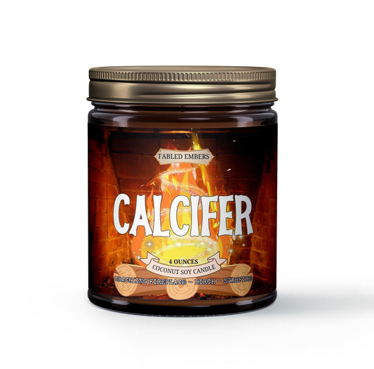 Amber jar candle with a vibrant label depicting Calcifer from Howl's Moving Castle, surrounded by crackling flames. The candle is labeled "Fabled Embers - Calcifer" and is scented with crackling fireplace, birch, and starfire.