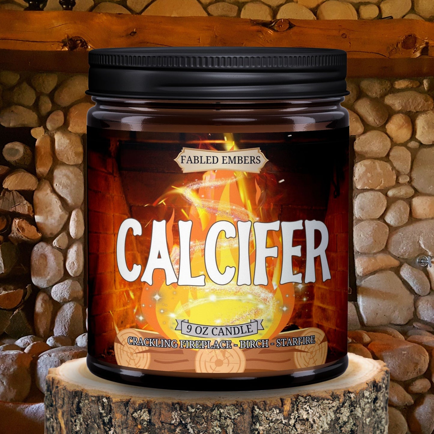 Amber jar candle with a vibrant label depicting Calcifer from HMC, surrounded by crackling flames. The candle is labeled "Fabled Embers - Calcifer" and is scented with crackling fireplace, birch, and starfire.