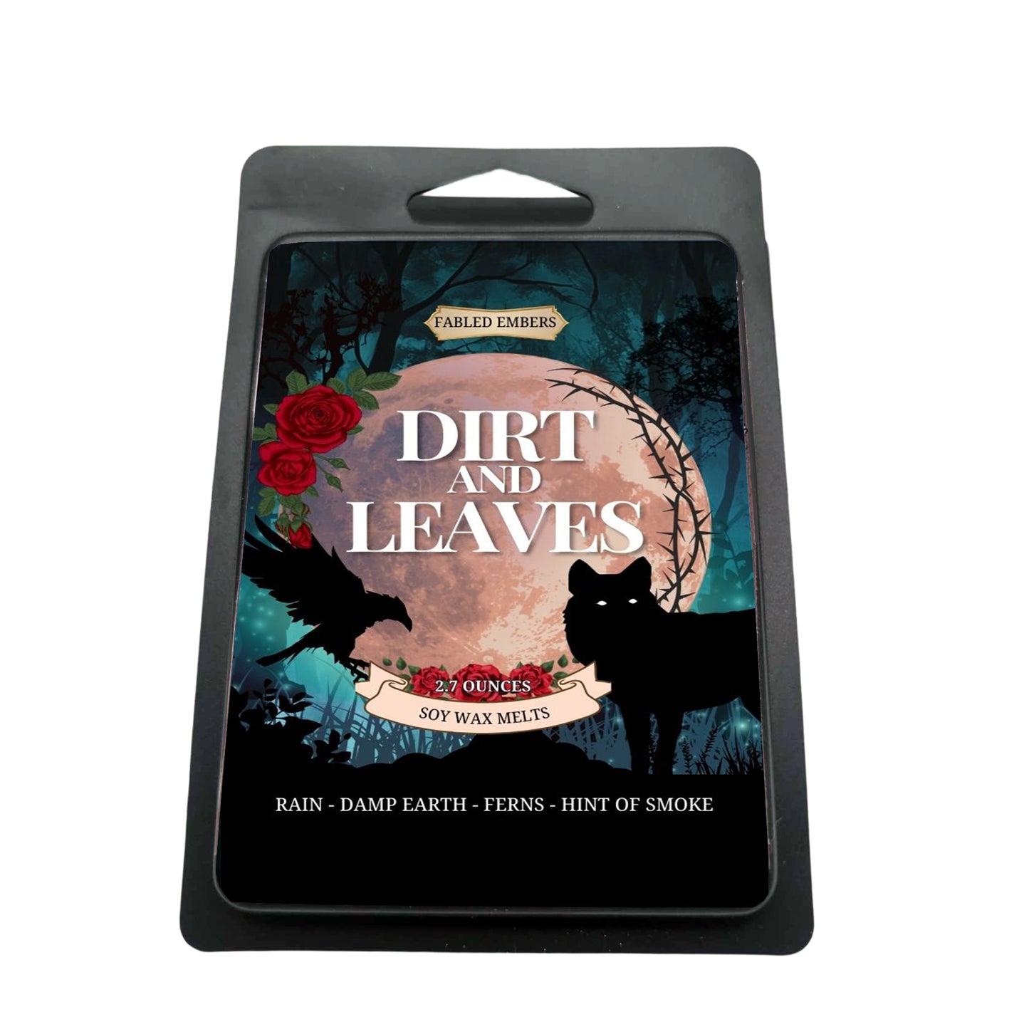 black clamshell "Dirt and Leaves" wax melts with a dark and moody label. Artwork depicts a black raven and a wolf in a shadowy forest scene with a full moon, red roses, and a touch of blue. Scent notes: rain, damp earth, ferns, and a hint of smoke.