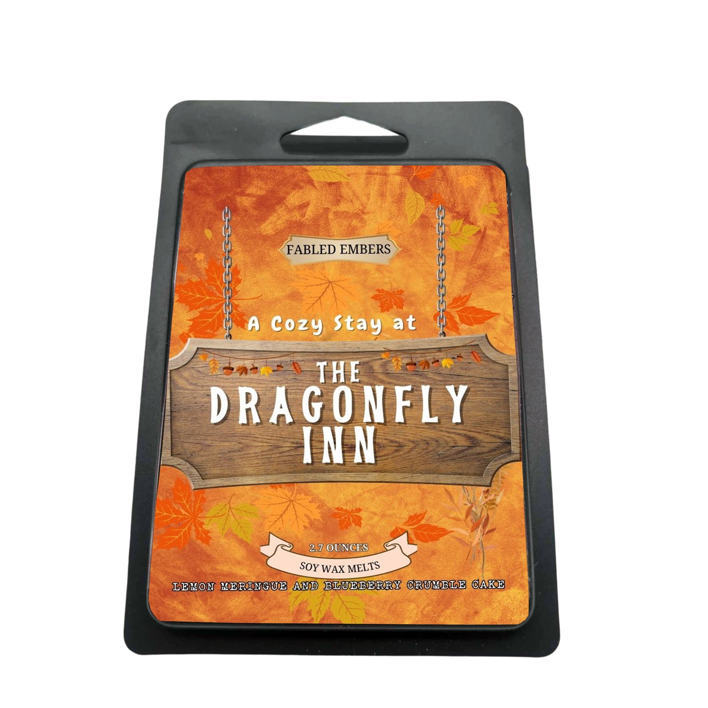 Packaging of 'The Dragonfly Inn' wax melts with autumn leaf design.