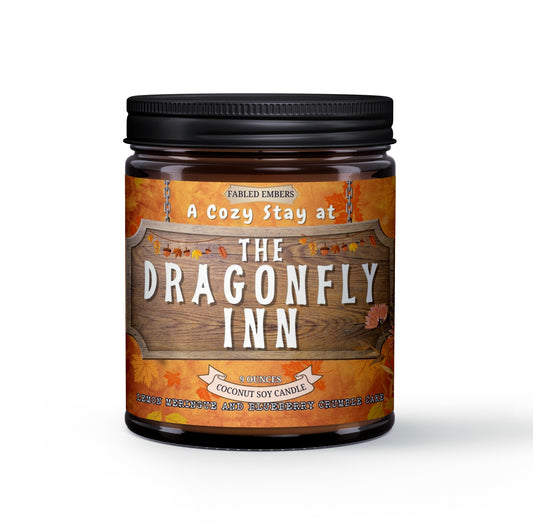 Candle jar with 'The Dragonfly Inn' label on a white background