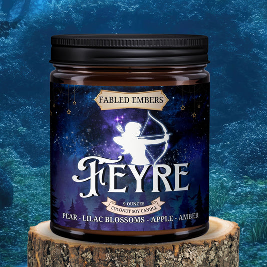 Fabled Embers Feyre candle jar on a wooden stump with a blue textured background