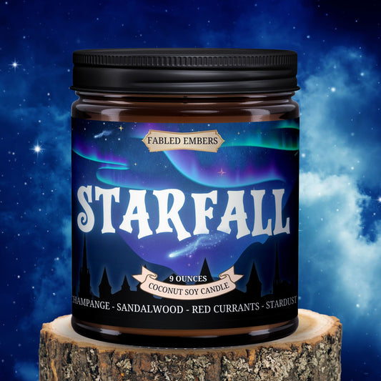Candle jar labeled 'Starfall' by Fabled Embers on a wooden stump with a starry night sky background.