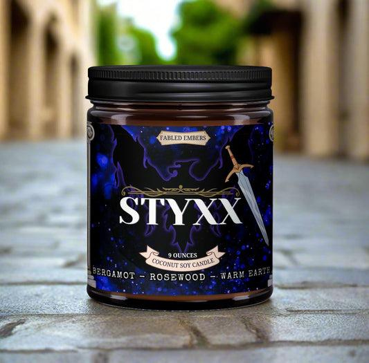 Styxx candle jar with black lid on a white background