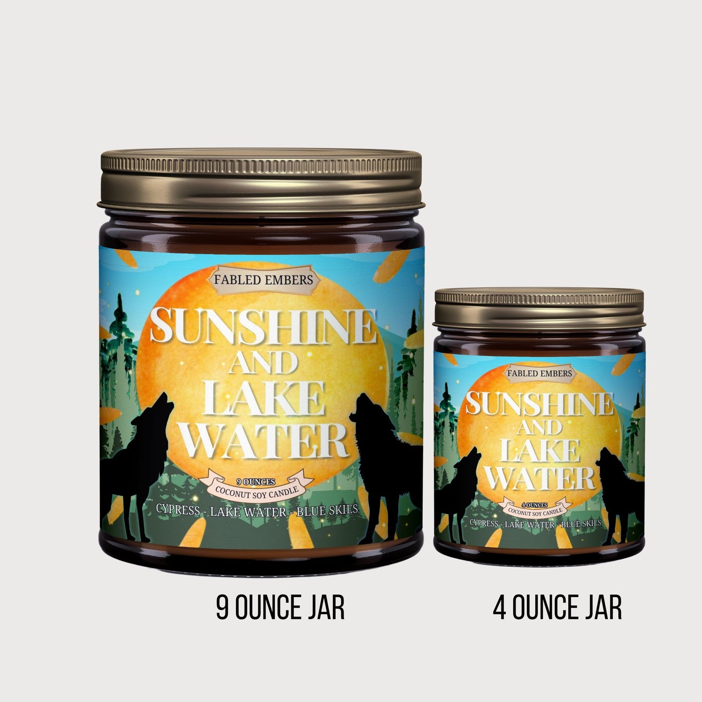 "Sunshine and Lake Water" coconut soy candle. Its vibrant label features howling wolves silhouetted against a setting sun, with a whimsical forest and bright blue skies.