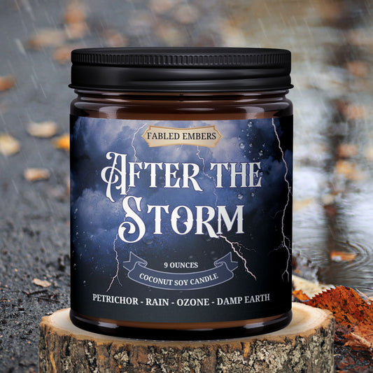 Candle jar labeled 'After the Storm' by Fabled Embers on a wooden stump with a rainy background.