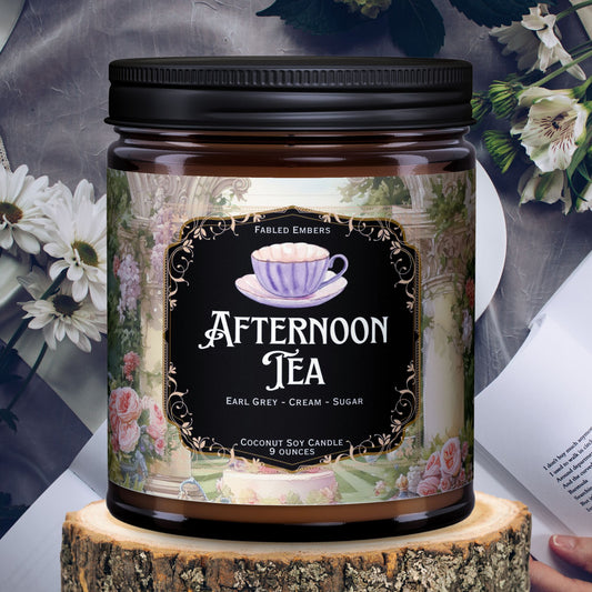 Afternoon Tea Bookish Candle smells like tea time earl grey tea with cream and sugar in an amber glass jar