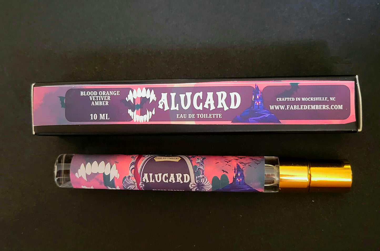 Alucard eau de toilette with packaging on a dark background