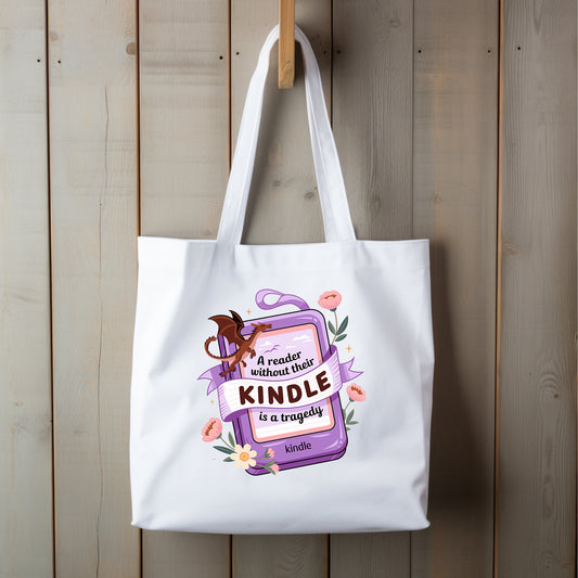 White tote bag with a Kindle graphic with a red dragon and pink and white flowers in a cartoon style on a wooden background