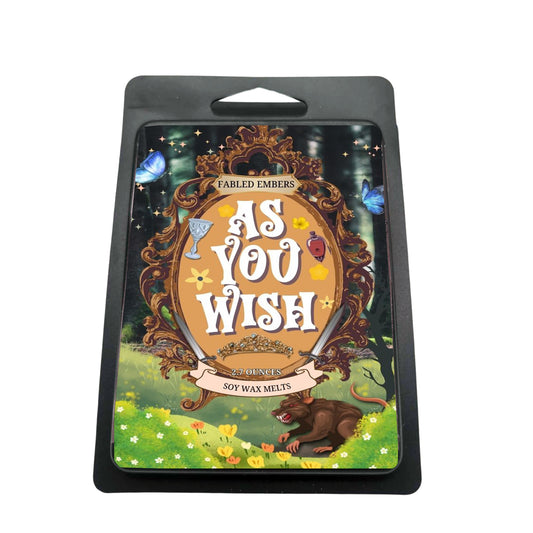 "As You Wish" soy wax melts are simply inconceivable! The enchanting label, featuring an ornate frame with swords, goblets, and those iconic blue butterflies, captures the magic of your favorite nostalgic fairy tale. Scented with lemon, oakmoss, rose, and amber, it's perfect for reliving epic adventures (or just enjoying a cozy read).