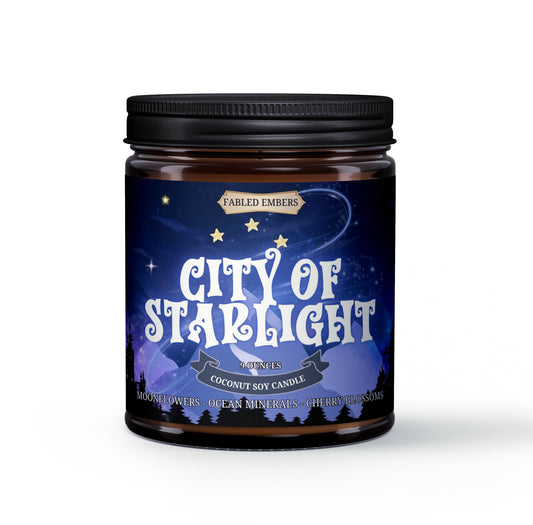 Candle jar labeled 'City of Starlight' by Fabled Embers on a white background