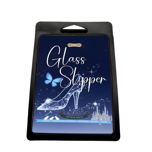Packaging for 'Glass Slipper' wax melts with a shoe design and castle illustration on a blue background.
