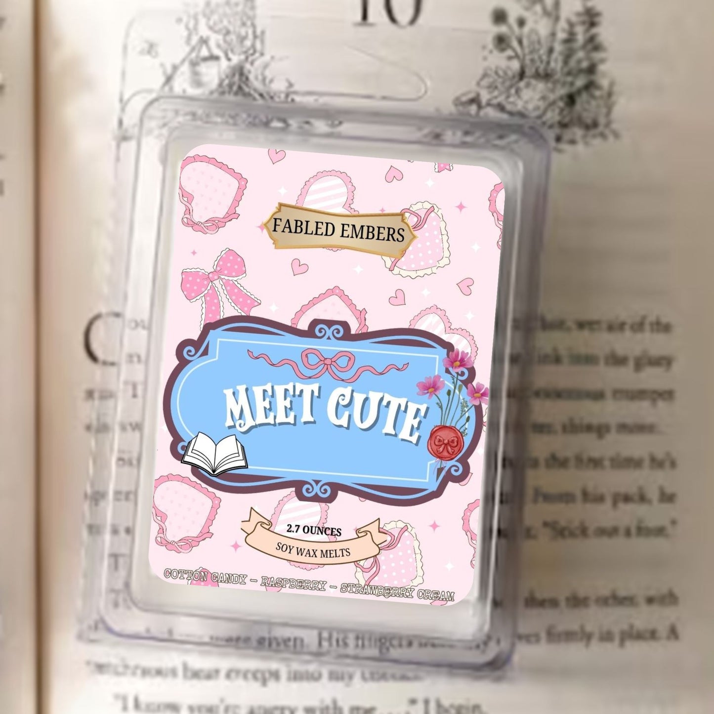Fabled Embers 'Meet Cute' wax melt packaging on a book page