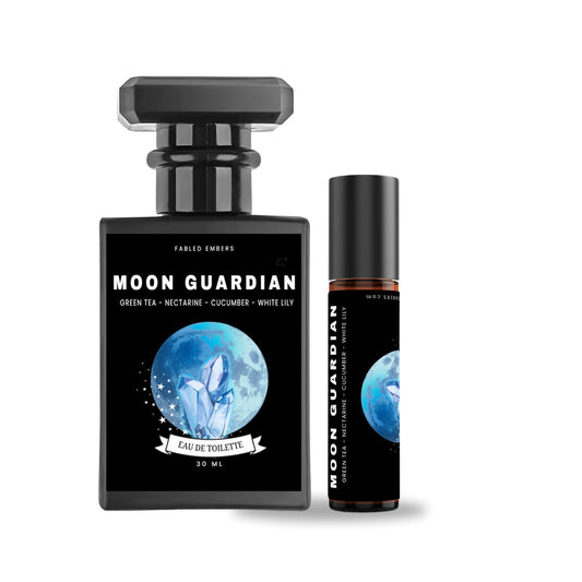 Image shows two bottles of MOON GUARDIAN Perfume, one larger 30ml black matte bottle with a metal atomizer, and a smaller 10ml amber glass vial with a metal atomizer. Both bottles have labels with the product name and a moon motif.