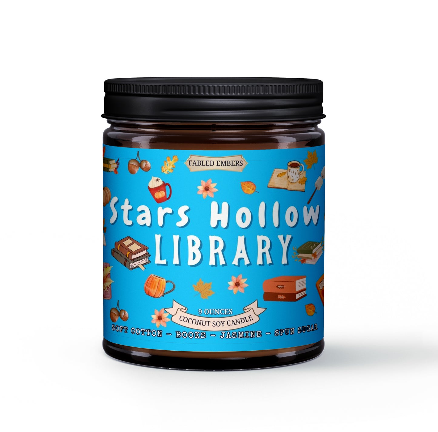 Candle jar labeled 'Stars Hollow Library' with a blue label featuring illustrations on a white background.