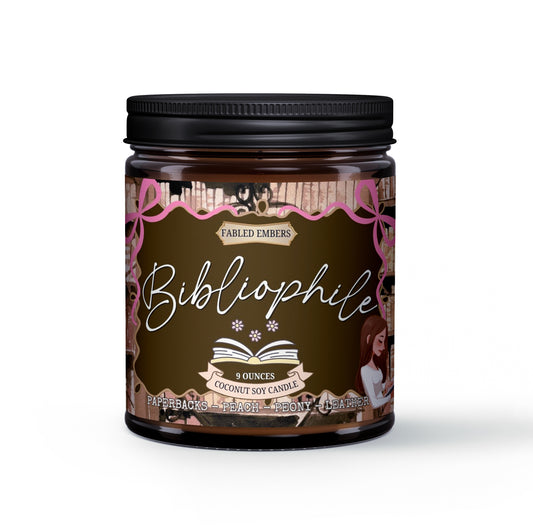 Candle jar labeled 'Bibliophile' with decorative design on a white background