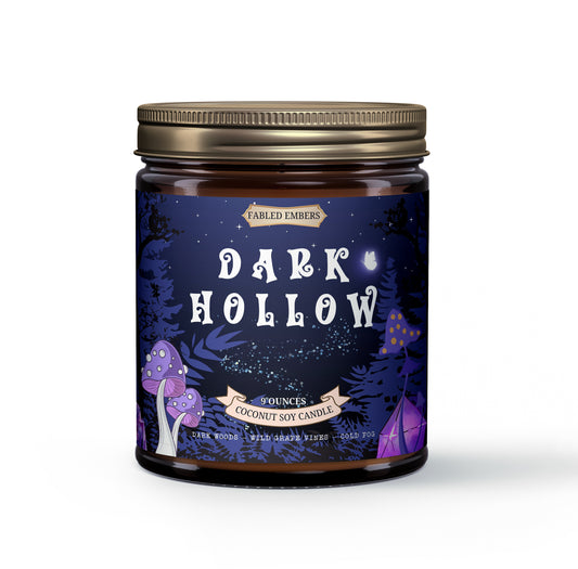 Mysterious "Dark Hollow" coconut soy candle. Features a deep purple-blue woodland label with whimsical purple mushrooms, glowing fireflies, and subtle stars. Perfect for gothic reading nooks.