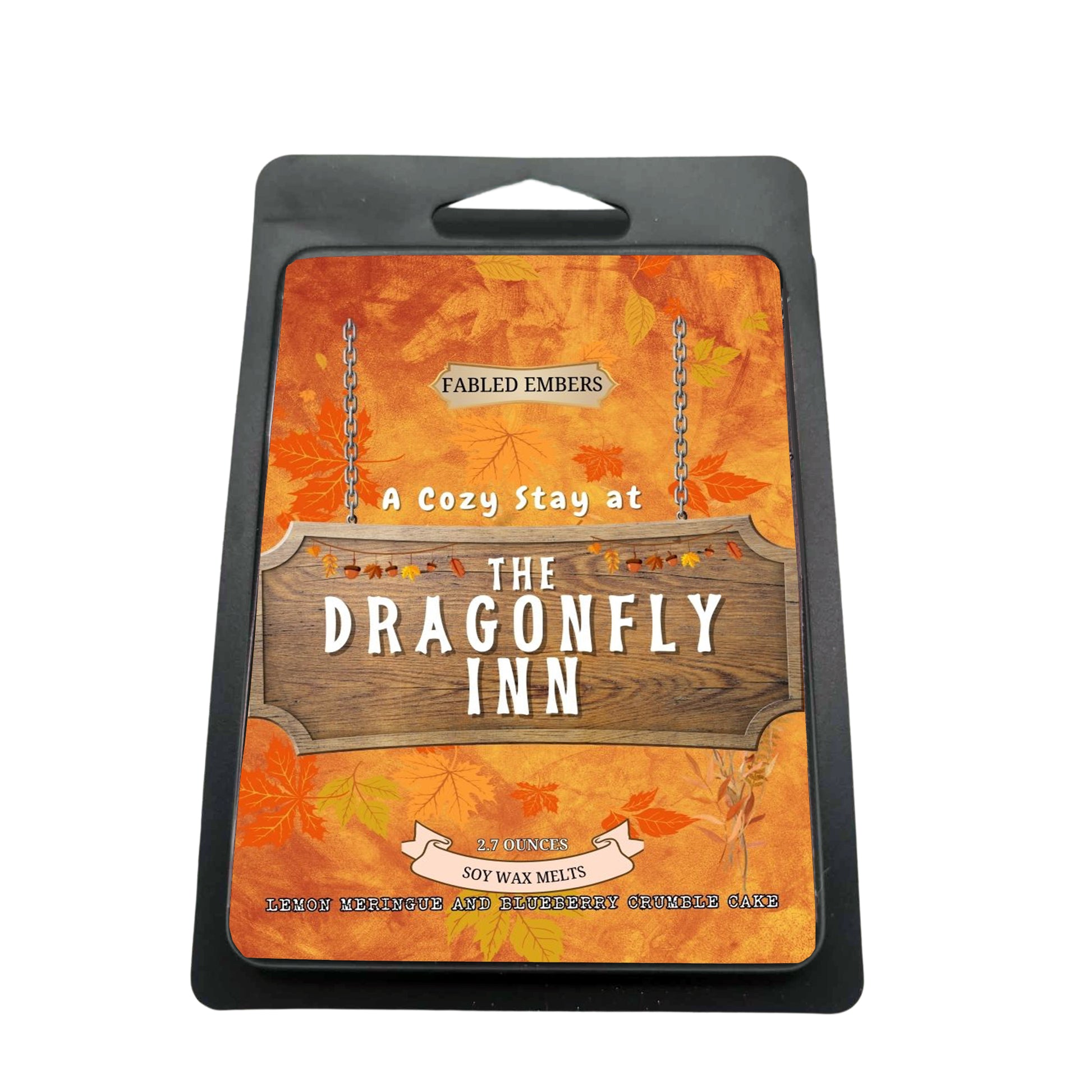 Packaging of 'The Dragonfly Inn' wax melts with autumn leaf design.