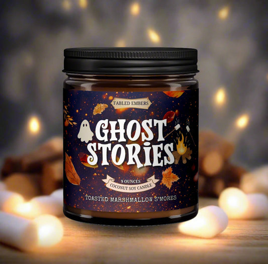 Candle jar labeled 'Ghost Stories' with a dark label featuring text and graphics on a white background.