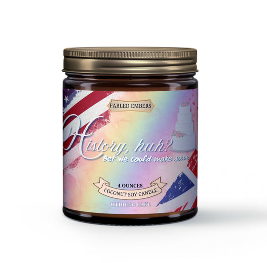 Amber jar candle with a distressed label featuring the US flag and Union Jack, a white tiered wedding cake, and the phrase "History, huh? Bet we could make some." The candle is scented with Wedding Cake, Buttercream, and Frosted Berries.