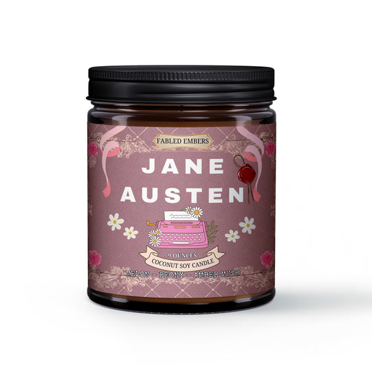 Step into a Regency romance with our "Jane Austen" coconut soy candle. Its elegant label features a vintage pink typewriter, delicate daisies, and rose-adorned scrolls on a charming damask background. Scented with melon, peony, and amber, it's perfect for your literary escape.