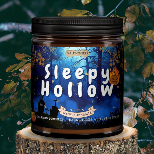 Candle jar labeled 'Sleepy Hollow' on a wooden stump with autumn leaves in the background