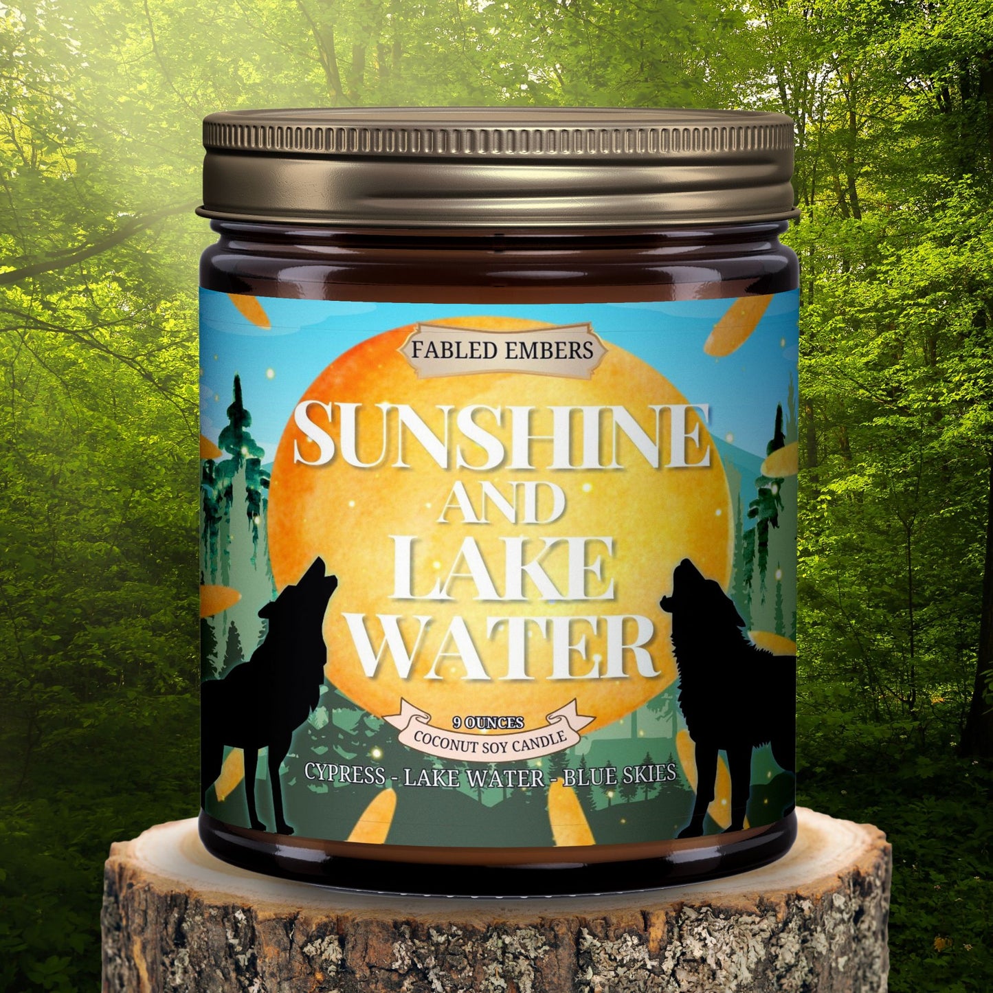"Sunshine and Lake Water" coconut soy candle. Its vibrant label features howling wolves silhouetted against a setting sun, with a whimsical forest and bright blue skies. 