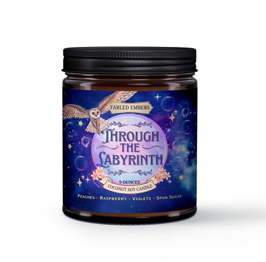 Get lost in a world of enchantment with our "Through the Labyrinth" coconut soy candle. The captivating label features a whimsical owl soaring over a starry, swirling galaxy, with delicate floral accents. Scented with a dreamy blend of peaches, raspberry, violets, and spun sugar, it's perfect for escaping into your favorite fantasy novels.