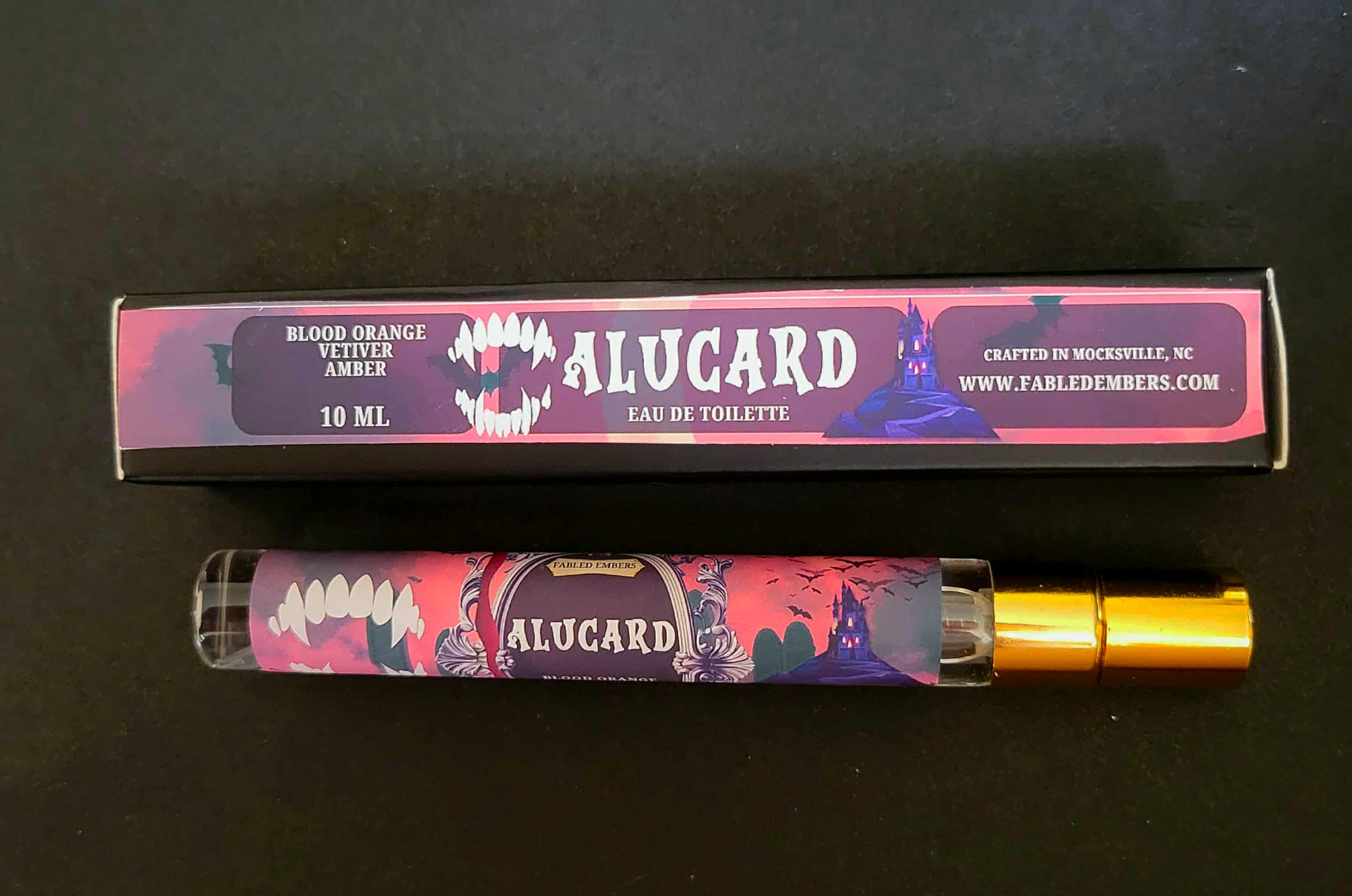 Alucard eau de toilette with packaging on a dark background