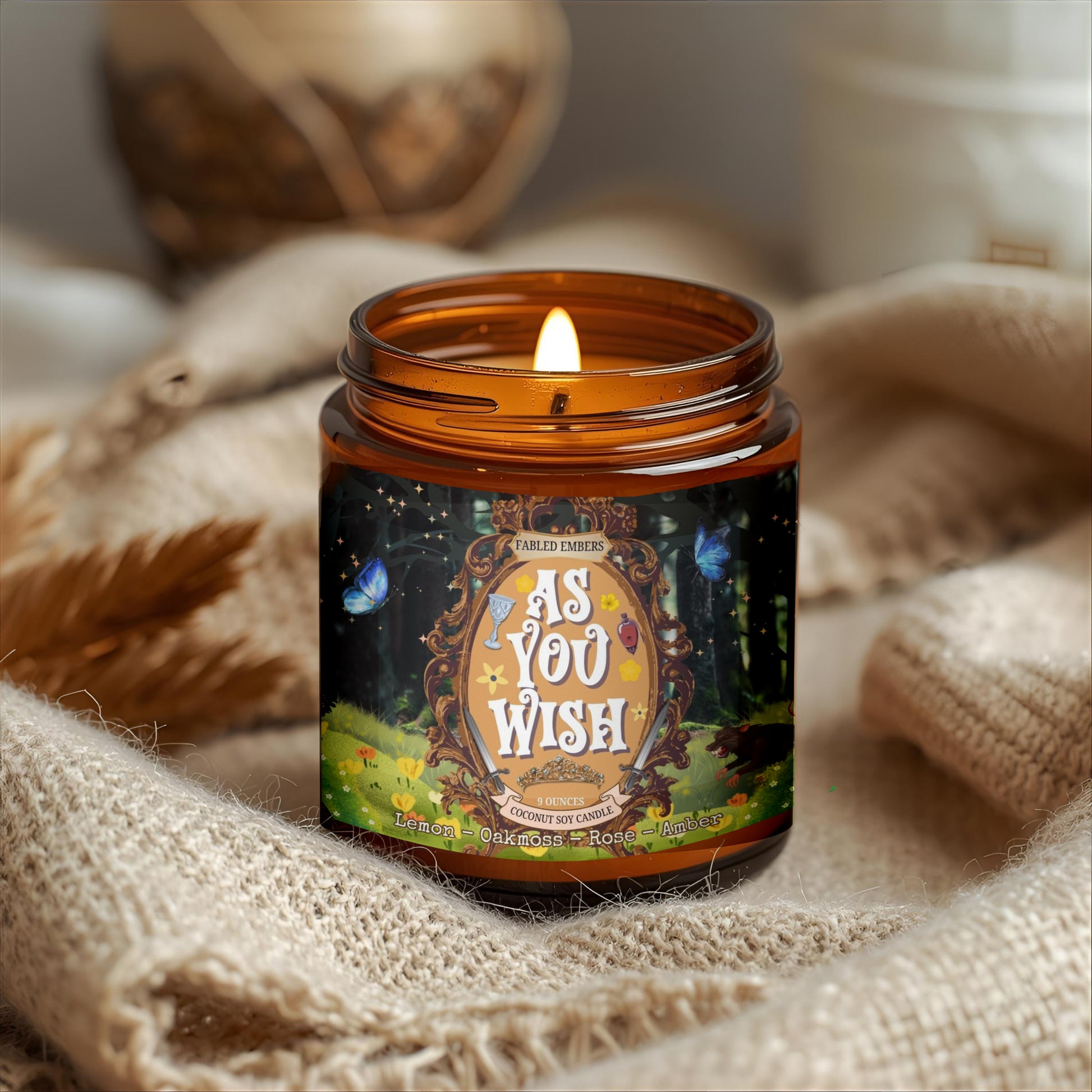 Candle in an amber jar with decorative label on a textured surface