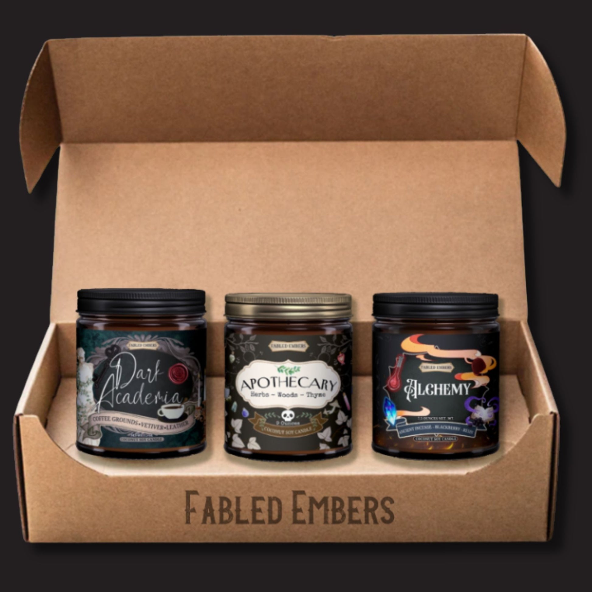 Three candles in a cardboard box with 'Fabled Embers' branding on a dark background