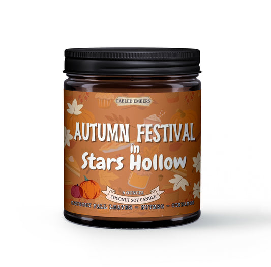 Candle jar labeled 'Autumn Festival in Stars Hollow' with an orange label on a white background