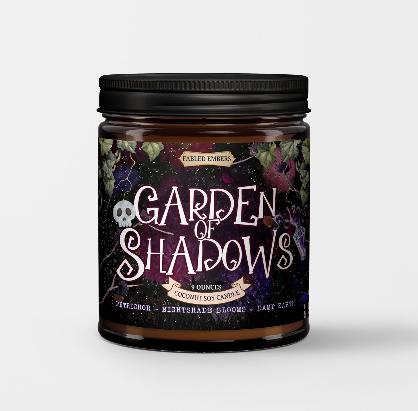 Candle jar labeled 'Garden of Shadows' with a dark label featuring text and graphics.