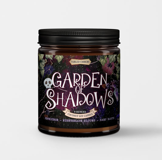 Candle jar labeled 'Garden of Shadows' with a dark label featuring text and graphics.