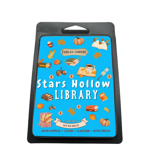 Packaging for 'Stars Hollow Library' wax melts with illustrations on a blue background.