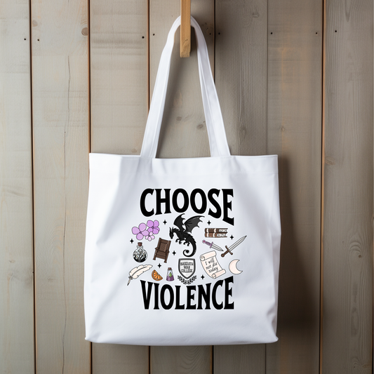 White tote bag with 'Choose Violence' text and symbols on a wooden background